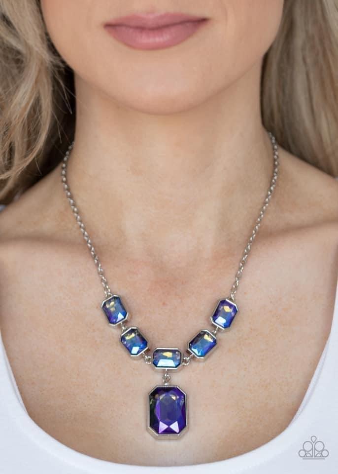 Paparazzi Accessories Million Dollar Moment - Multi Featuring an out-of-this-world iridescence, emerald-cut blue gems delicately link below the collar. Attached to a dainty silver chain, the glittering row of rhinestones gives way to a dramatically oversi