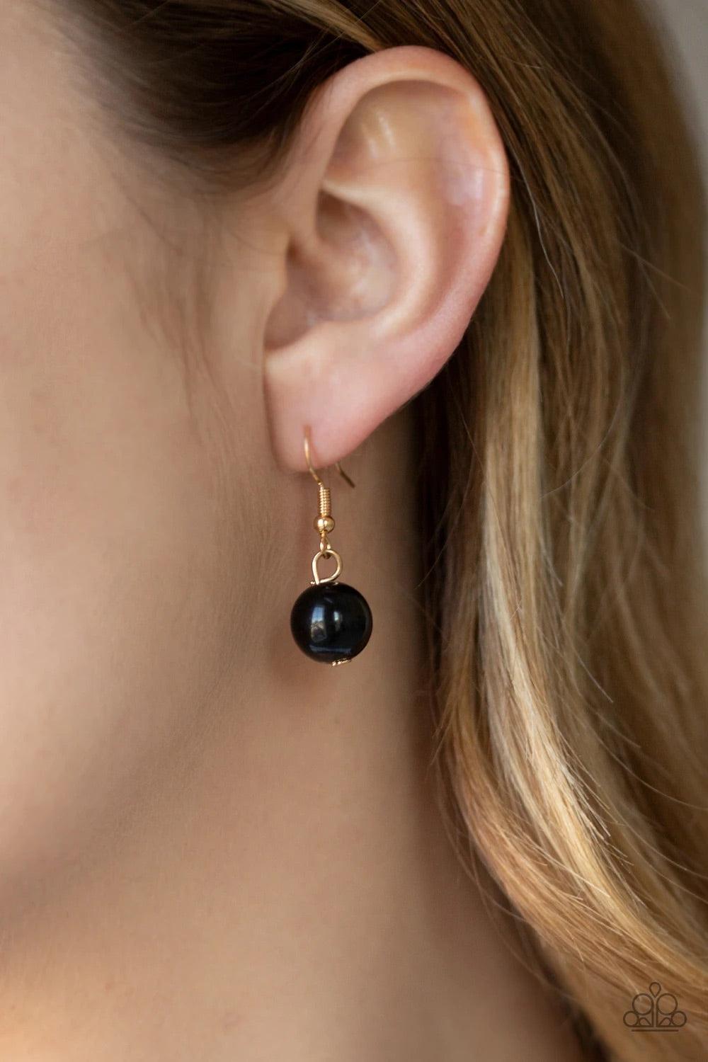 Paparazzi Accessories Get Off My Runway - Gold Bubbly black beads swing from the bottom of a hefty gold chain, creating a dramatic fringe below the collar. Features an adjustable clasp closure. Sold as one individual necklace. Includes one pair of matchin