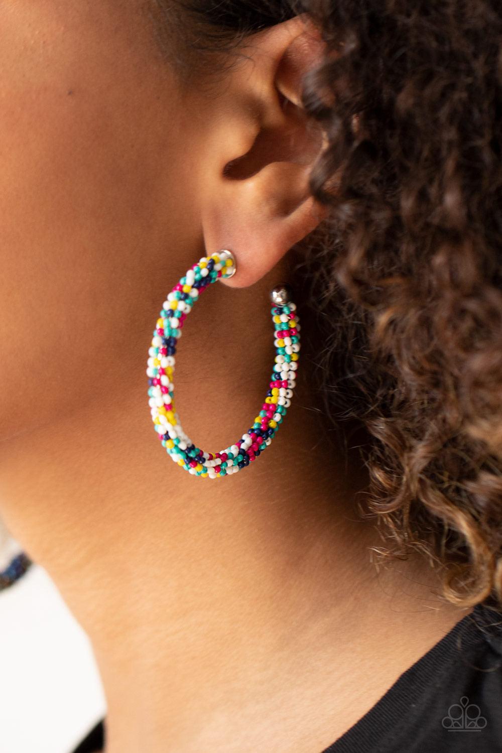 Paparazzi Accessories BEAD My Lips - Multi A dainty collection of turquoise, Blue Depths, yellow, Pink Peacock, and white seed beads colorfully adorns a classic hoop for a beautifully beaded look. Earring attaches to a standard post fitting. Hoop measures