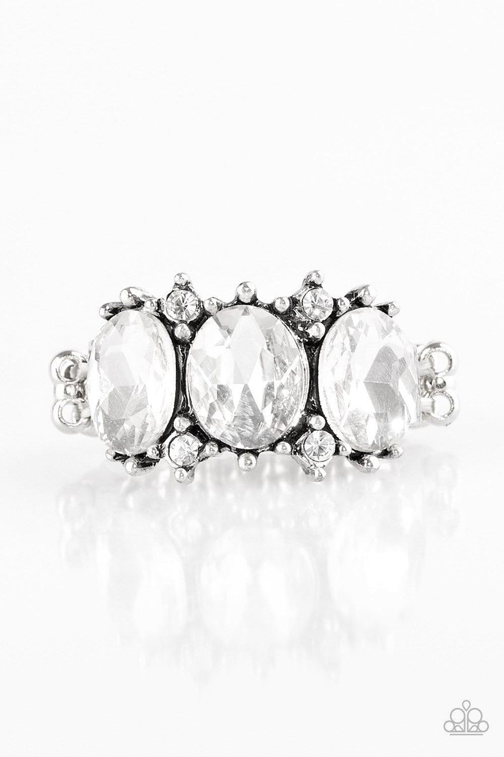 Paparazzi Accessories Straighten Your Crown - White Featuring oval cuts, glittery white rhinestones are encrusted along a regal silver band dotted in dainty white rhinestones. Features a dainty stretchy band for a flexible fit. Jewelry