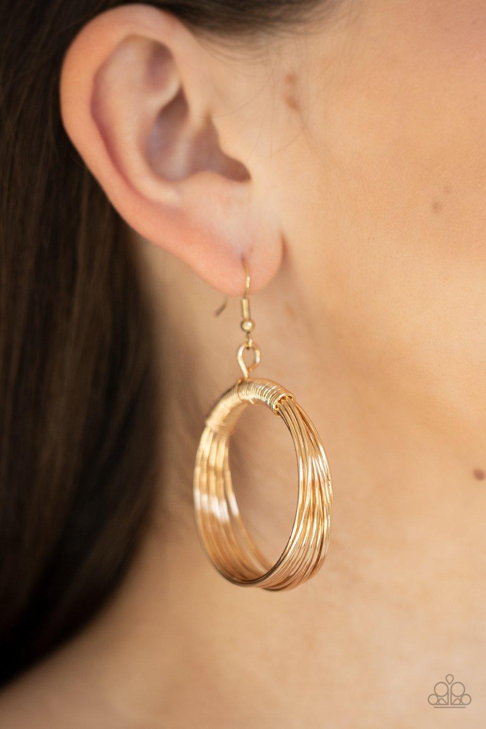 Paparazzi Accessories Urban Sun - Gold Dainty gold wire delicately wraps around layers of coiled gold wire, creating an edgy hoop. Earring attaches to a standard fishhook fitting. Sold as one pair of earrings. Jewelry