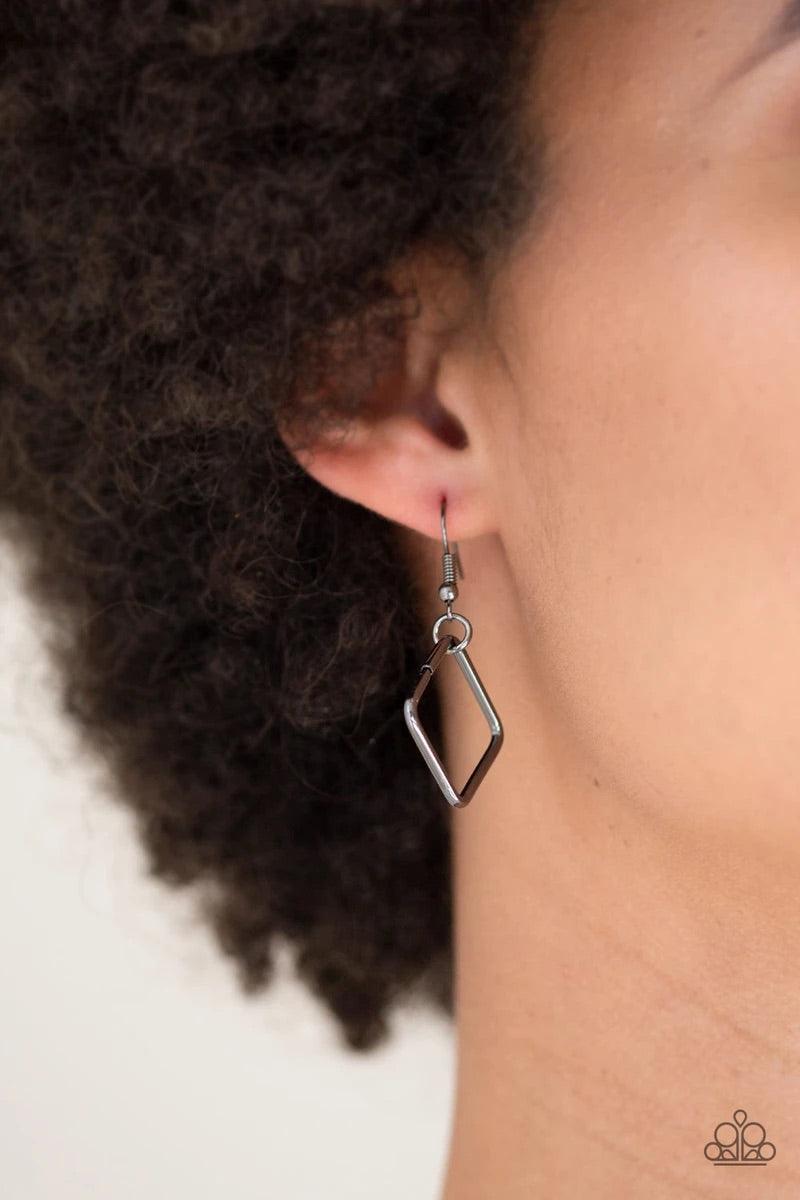 Paparazzi Accessories Backed Into A Corner - Black Varying in size, airy gunmetal square silhouettes link across the chest for an edgy look. Features an adjustable clasp closure. Sold as one individual necklace. Includes one pair of matching earrings. Jew