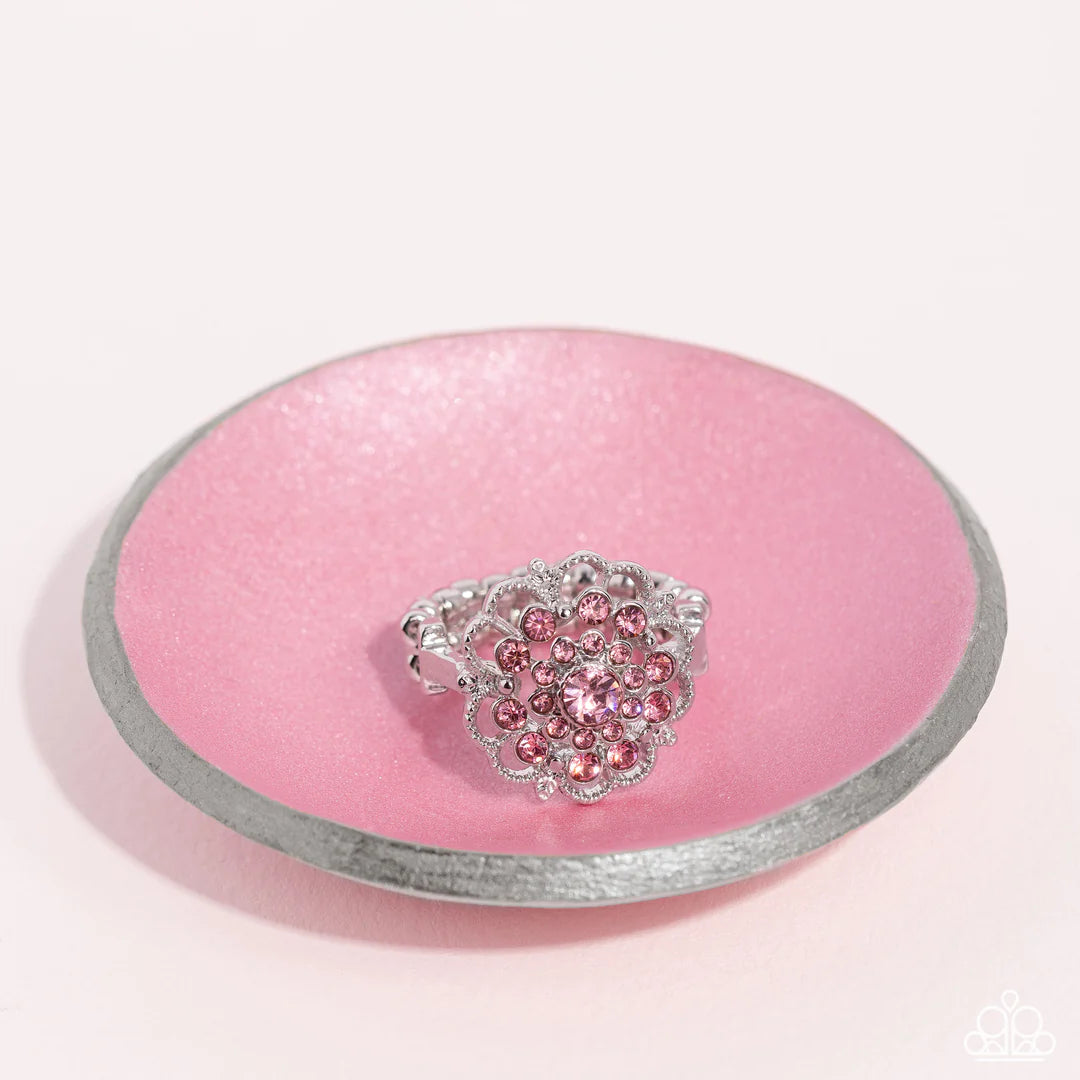 Paparazzi Accessories Love ROSE - Pink A studded, silver, airy rose dotted with an explosion of pink rhinestones ripples into layers of radiance for a whimsical centerpiece atop the finger. Features a dainty stretchy band for a flexible fit. Sold as one i
