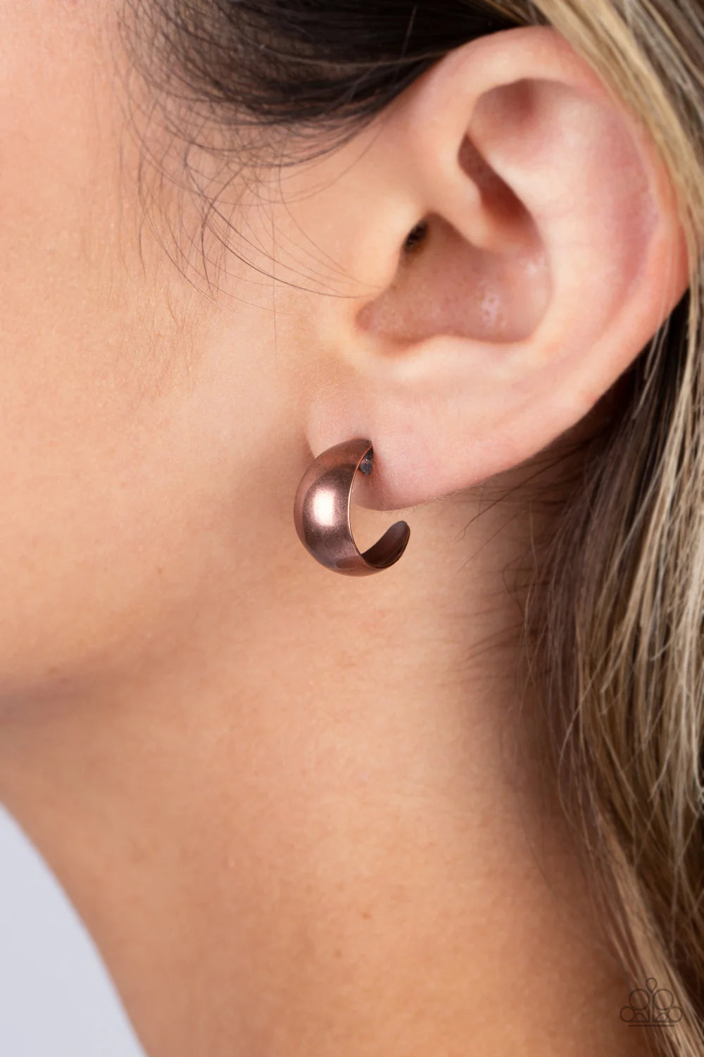 Paparazzi Accessories Burnished Beauty - Copper A thick bar of copper curls around the ear into a fashionable hoop. The dramatic curvature of the hoop is heightened by its high sheen finish, making a lasting impression. Earring attaches to a standard post