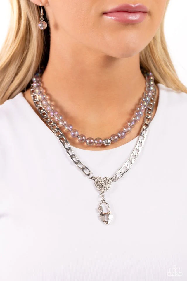 Paparazzi Accessories Turn Back The Clock - Silver Layered atop a bold silver elongated curb chain, a strand of gray clear beads featuring an iridescent shimmer is threaded along an invisible wire below the collar, resulting in a colorfully layered design