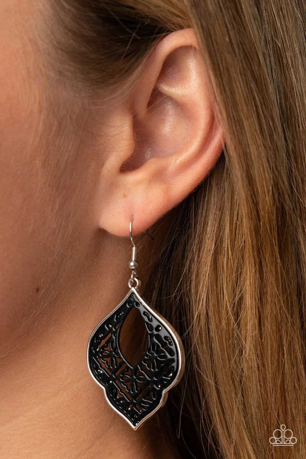 Paparazzi Accessories Thessaly Terrace - Black Painted in a shiny black finish, a floral tile-like pattern blooms inside a scalloped silver frame for a whimsical floral look. Earring attaches to a standard fishhook fitting. Sold as one pair of earrings. J