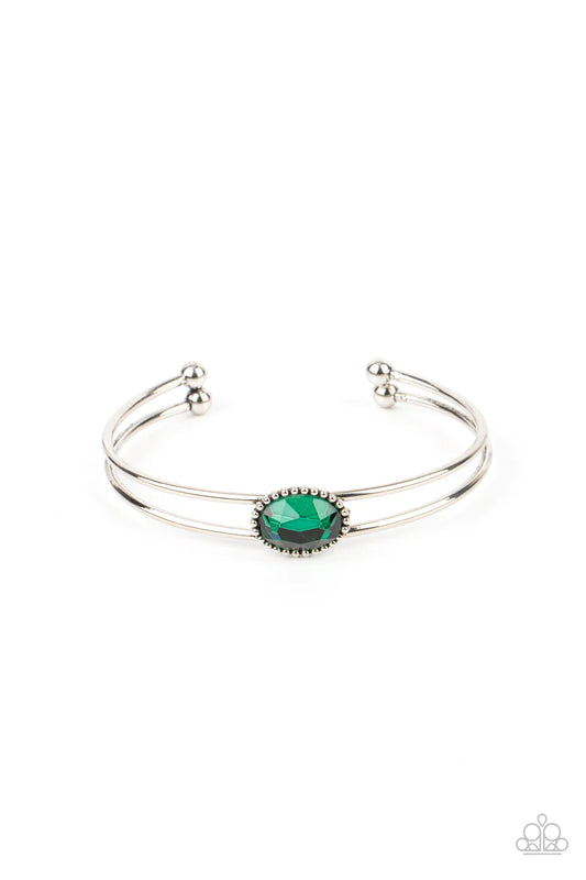 Paparazzi Accessories Magnificently Mesmerized - Green Encased in a studded silver frame, a glittery green gem sits atop a layered silver cuff, creating a mesmerizing centerpiece around the wrist. Sold as one individual bracelet. Jewelry