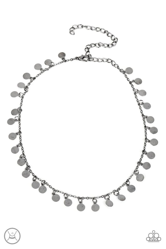 Paparazzi Accessories Champagne Catwalk - Black Tiny gunmetal discs dance along a classic gunmetal chain, creating an understated choker necklace. The reflective surfaces of the discs shimmer brightly, as the light catches their high sheen finish to exagg