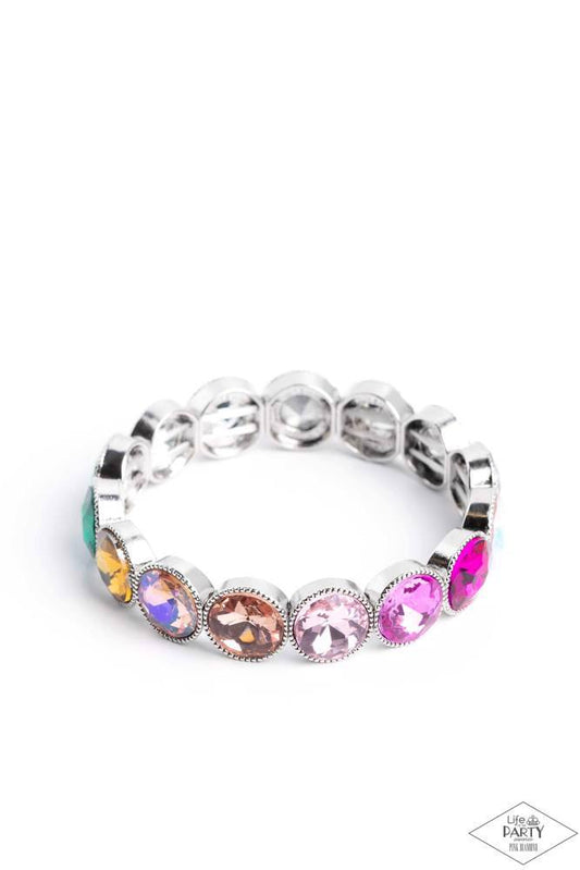 Paparazzi Accessories Number One Knockout - Multi 3 Faceted gems in colorful shades featuring varying shimmers and iridescence are pressed into sleek silver frames. The glittery frames are threaded along elastic stretchy bands, creating a glamorous look a