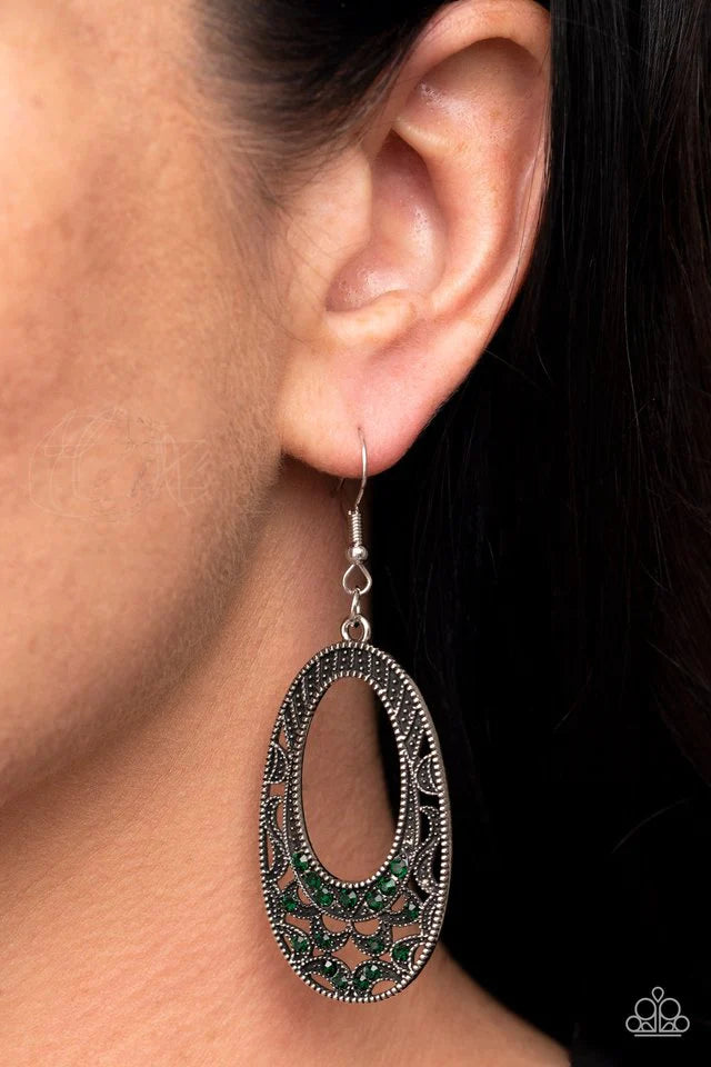 Paparazzi Accessories Colorfully Moon Child - Green Dotted with dainty green rhinestones, a studded oval frame sprinkled in silvery half moon accents for a spellbinding finish. Earring attaches to a standard fishhook fitting. Jewelry