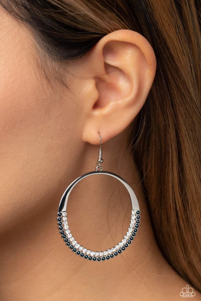 Paparazzi Accessories Material Pearl - Blue Encrusted on the lower curve of an oversized, dainty silver hoop, two dainty rows of white gems and classy Montana pearls add a subtle shimmer and refinement to the high-sheen statement piece. Earring attaches t