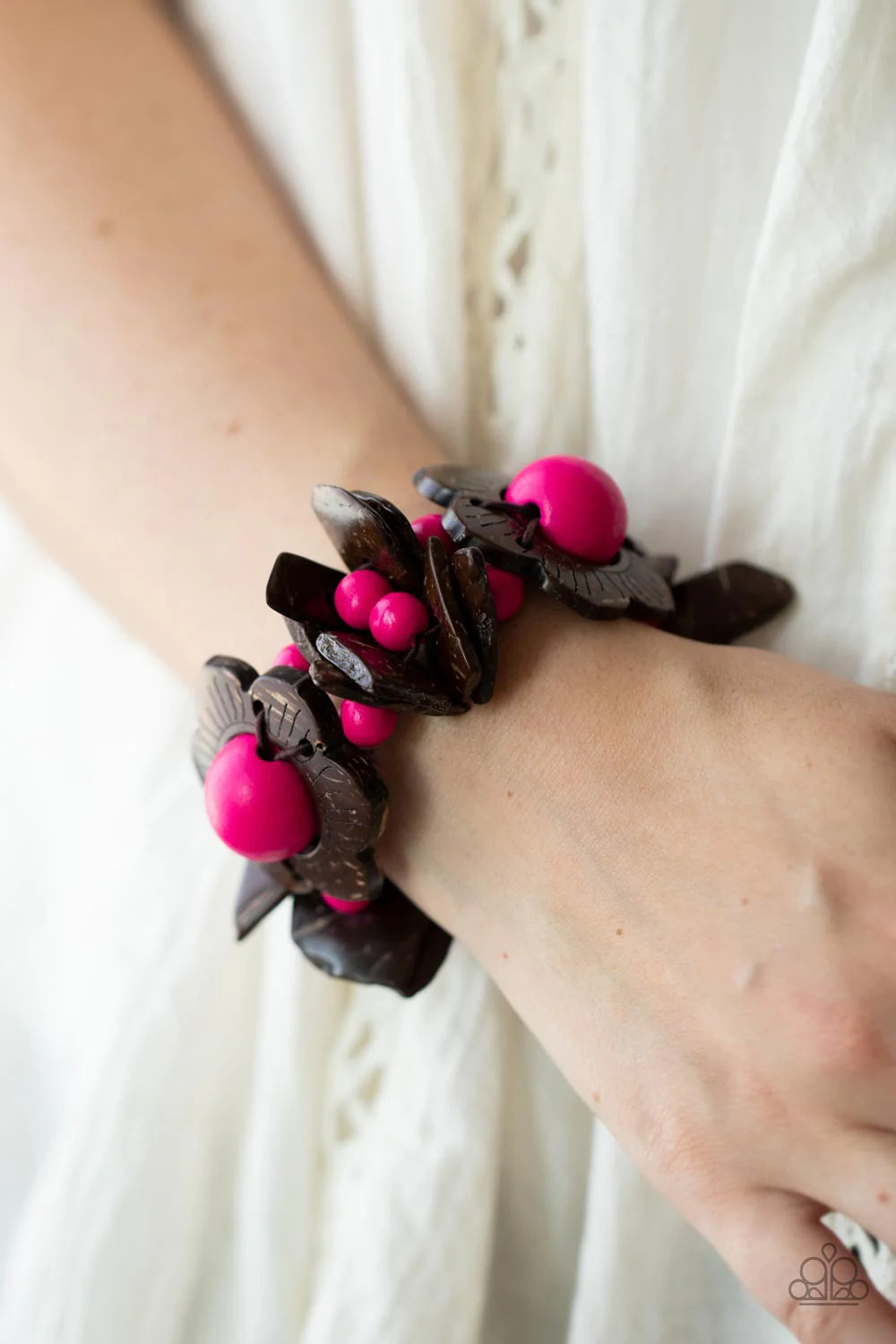 Paparazzi Accessories Mediterranean Mangrove - Pink Wooden flower petals with oversized vibrant pink bead centers creates a stunning statement. Double layers of irregular shaped wood chips and bright pink beads are threaded along stretchy bands adding dra