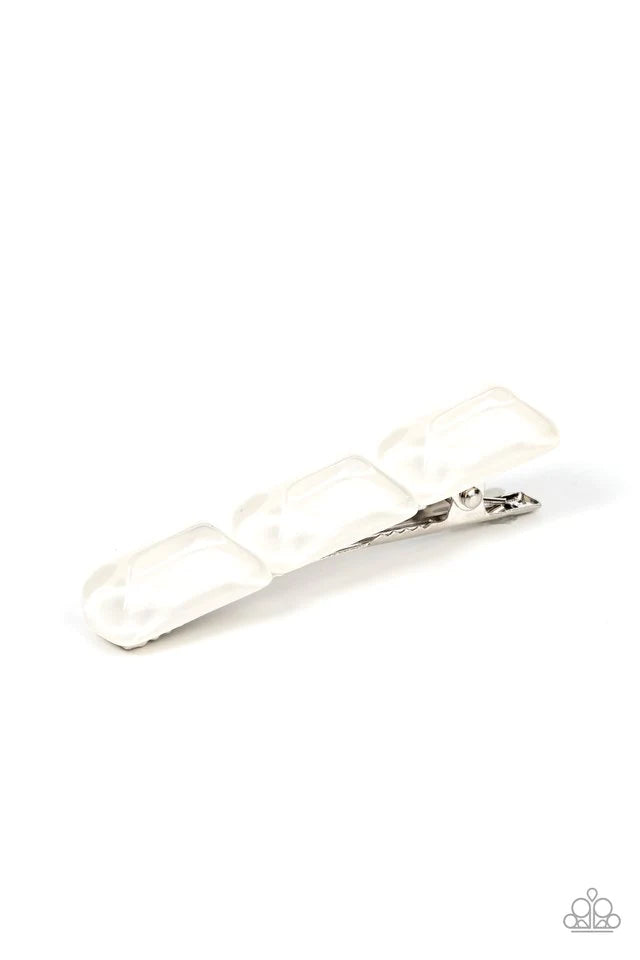 Paparazzi Accessories Gemstone Glimmer - White Enhanced with veins of light, a faceted collection of white faux gemstone beads embellishes the front of a classic silver frame for a tranquil fashion. Features a standard hair clip on the back. Hair Accessor