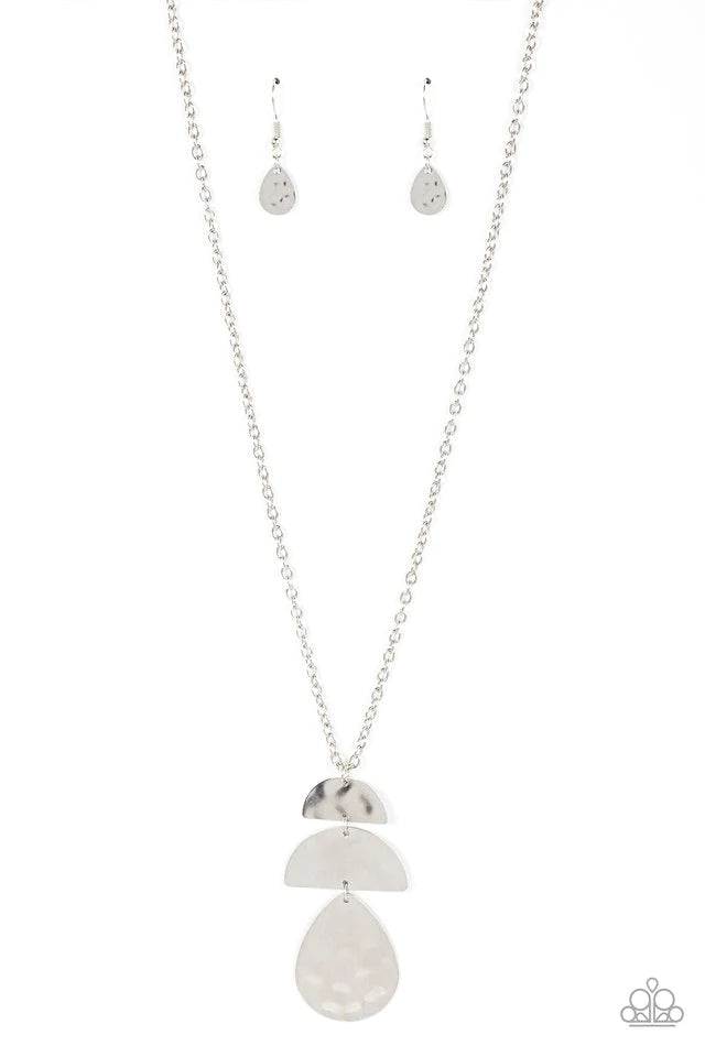 Paparazzi Accessories Mayan Mystery - Silver Brushed in a burnished shimmer, a hammered silver teardrop swings from the bottom of a pair of half moon silver frames that stack into a tribal inspired pendant at the bottom of a classic silver chain. Features