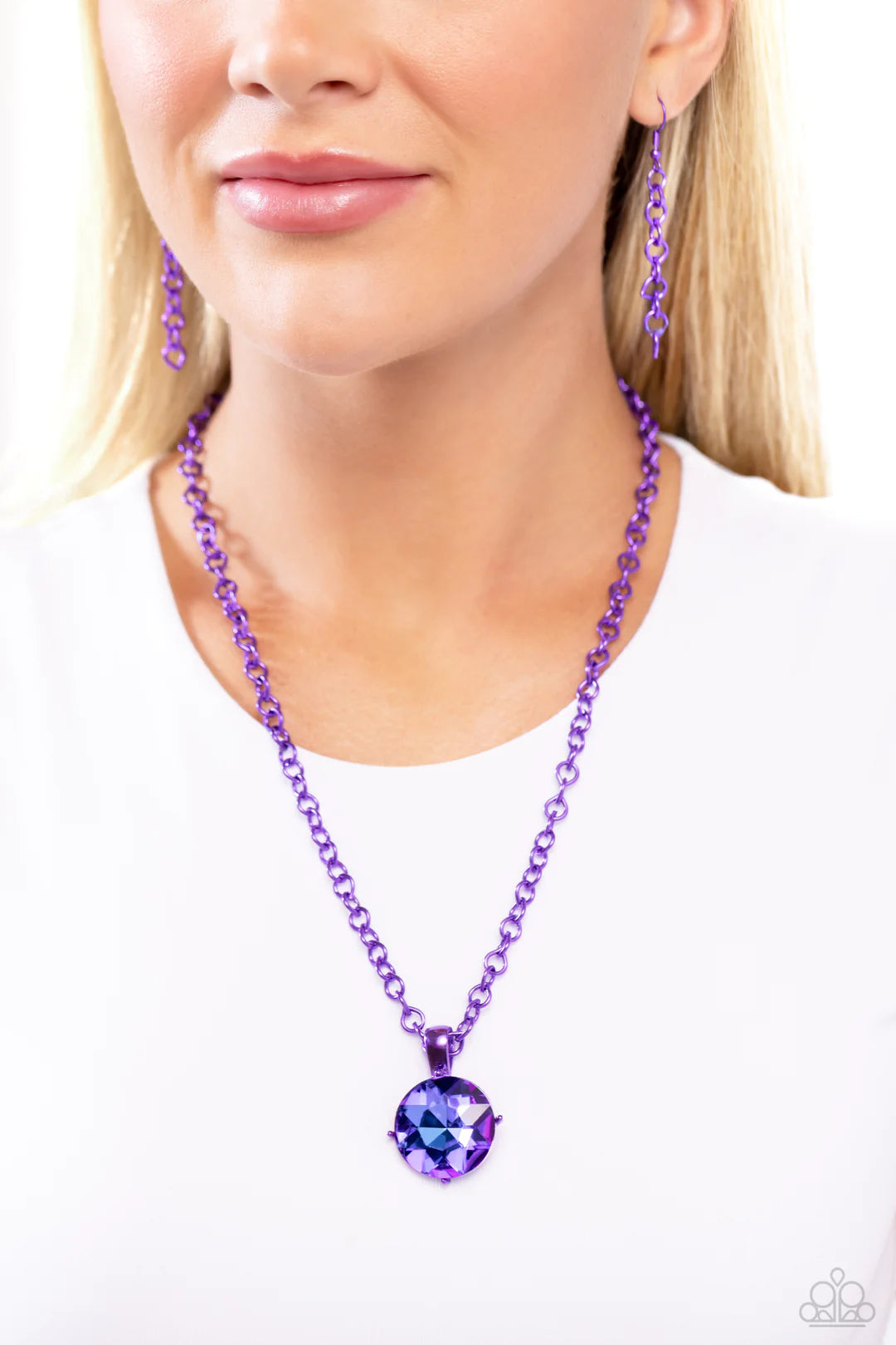 Paparazzi Accessories Las Vegas Dip - Purple Featuring a classic elongated chain in a vibrant purple hue, an oversized purple UV pendant in purple pronged fittings shimmers down the chest for a charismatic finish. Features an adjustable clasp closure. Sol