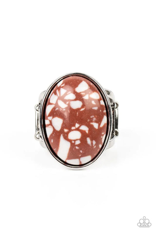 Paparazzi Accessories Majestic Marbling - Brown Featuring a colorful marble finish, a speckled brown stone is pressed into the center of a silver oval frame for a modern look. Features a stretchy band for a flexible fit. Sold as one individual ring. Jewel
