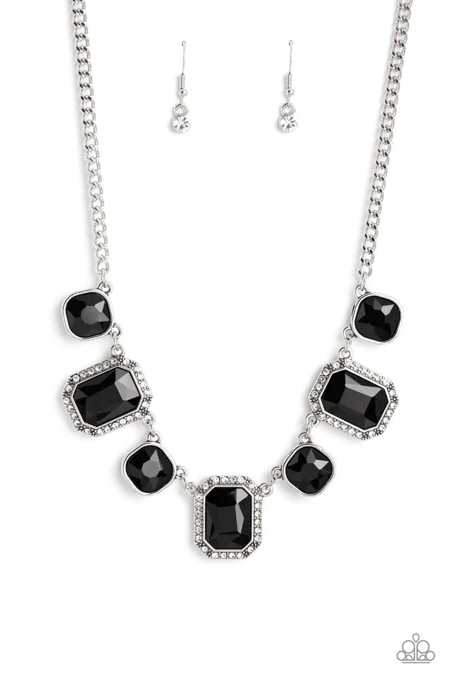 Paparazzi Accessories Royal Rumble - Black Dazzling gems, in both round and emerald-cuts, fall along the collar in an alternating pattern. Each gem is splashed in a dauntless, jet black hue amplifying its impact, while the emerald-cut gems showcase some g
