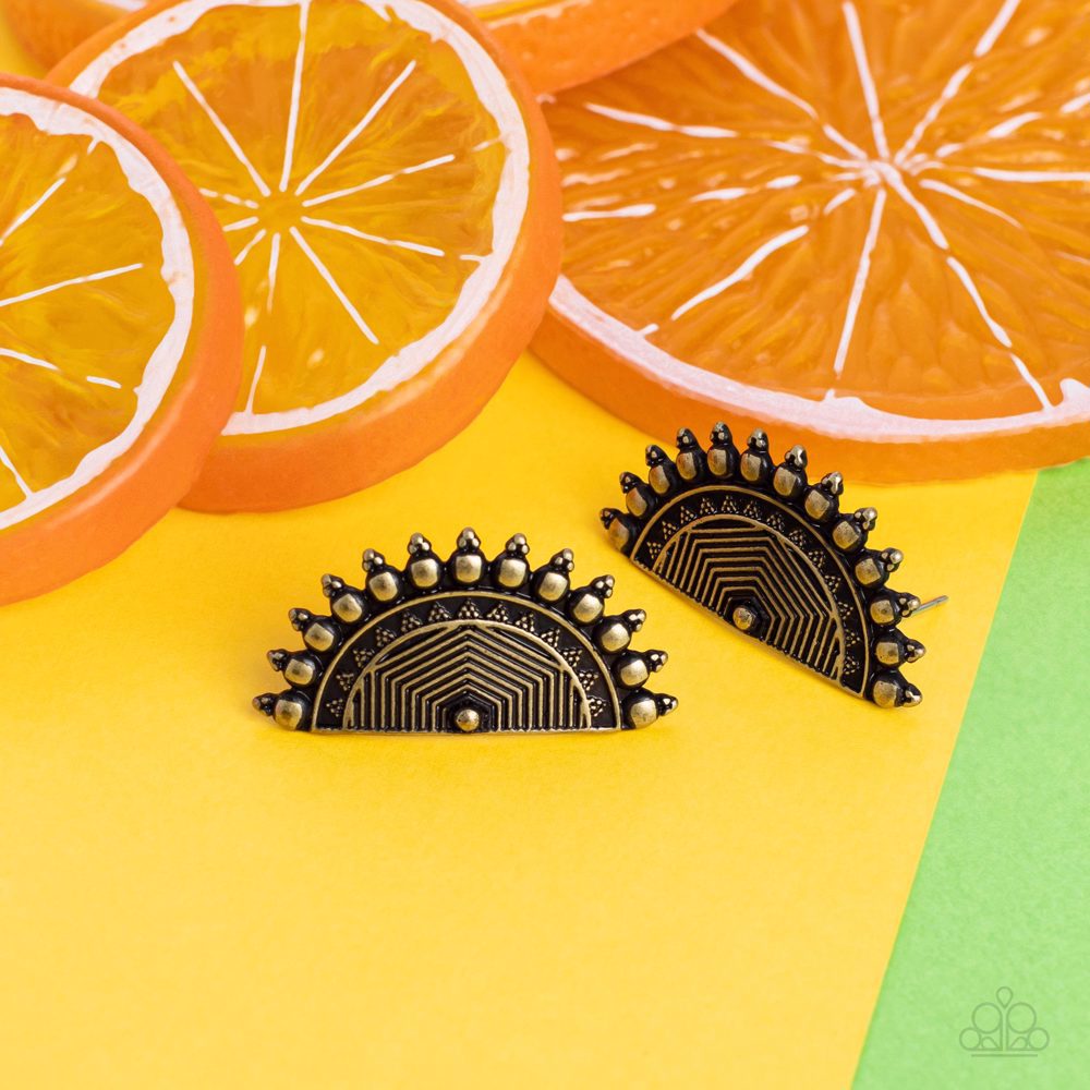 Paparazzi Accessories Fiercely Fanned Out - Brass Tipped with triangular accents, flat brass studs fan out from the edge of a half moon frame embossed in antiqued linear texture, creating a bold tribal inspired display. Earring attaches to a standard post