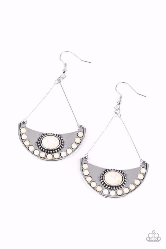 Paparazzi Accessories Canyon Canoe Ride - White Suspended from wire fittings, a silver half moon frame is dotted in refreshing white stone accents as it swings from the ear for an artisan inspired look. Earring attaches to a standard fishhook fitting. Sol