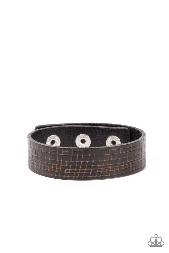 Paparazzi Accessories Rugged Reputation - Black The front of a black leather band is asymmetrically scratched in a rugged linear pattern, resulting in a rustic centerpiece around the wrist. Features an adjustable snap closure. Sold as one individual brace