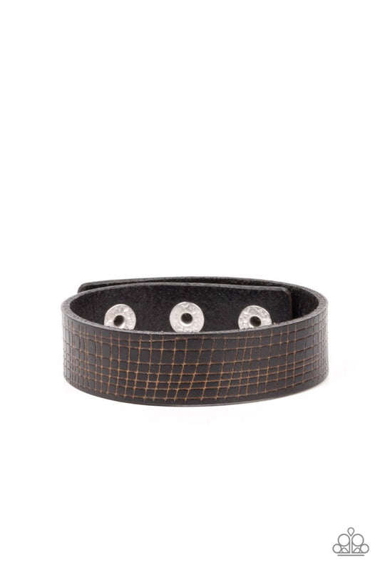 Paparazzi Accessories Rugged Reputation - Black The front of a black leather band is asymmetrically scratched in a rugged linear pattern, resulting in a rustic centerpiece around the wrist. Features an adjustable snap closure. Sold as one individual brace