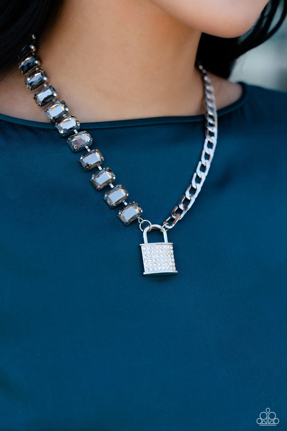 Paparazzi Accessories Lock and Roll - Silver Infused on a classic silver chain, a strand of thick silver curb chain, and a collection of exaggerated, smoky radiant-cut gems in silver pronged fittings combine to create a collision of industrial color aroun