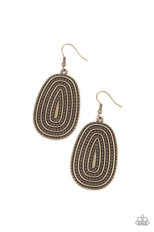 Paparazzi Accessories Desert Climate - Brass Rows of antiqued brass dotted texture radiate outward from an embossed center. The concentric lines create a rippling effect across the frame resulting in a rustic finish. Earring attaches to a standard fishhoo