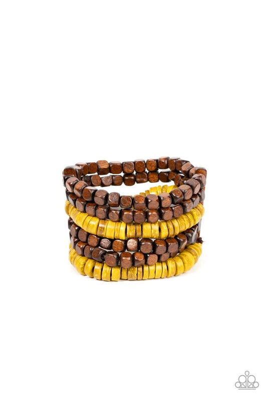 Paparazzi Accessories Fiji Fiesta - Yellow Stretchy strands of brown wooden cube beads and distressed yellow wooden discs are held in place by rectangular wooden frames, resulting in an earthy centerpiece around the wrist. Jewelry