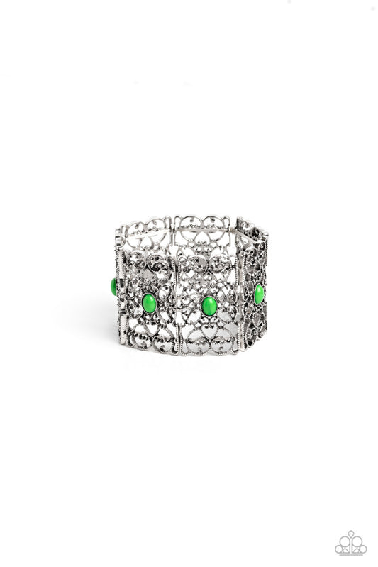 Paparazzi Accessories Fairest Filigree - Green Shiny green beads, set in vertical, rectangular frames of swirling silver filigree are infused along stretchy bands for a whimsically wild fashion around the wrist. Sold as one individual bracelet. Jewelry