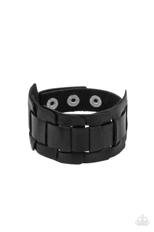 Paparazzi Accessories Plainly Plaited - Black A black leather band is threaded through the center of interlocking square leather links, creating a plaited pattern around the wrist. Features an adjustable snap closure. Sold as one individual bracelet. Jewe