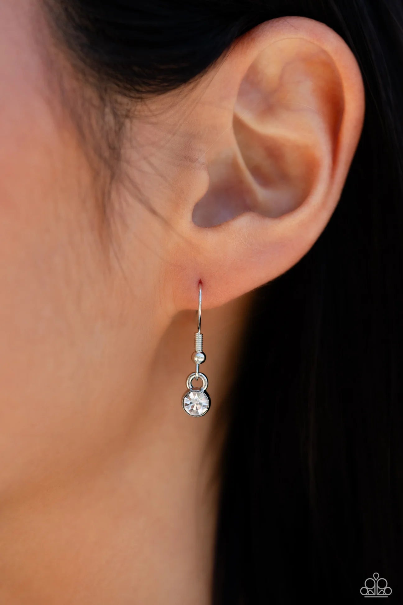 Paparazzi Accessories Lessons in Luxury - White Featuring a white rhinestone square-fitting chain, white teardrop-cut gems, bordered in silver pronged fittings, swing from streams of glittery rhinestones while solitaire teardrop gems drip in an alternatin