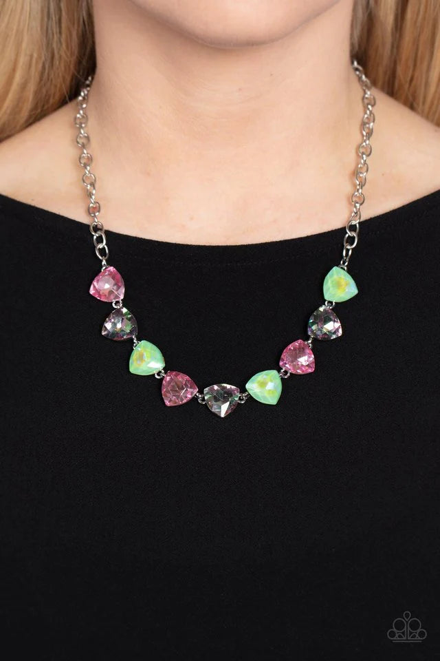 Paparazzi Accessories Dreamy Drama - Green A collection of dreamy trilliant-cut rhinestones in iridescent shades of green and pink fall in line along the collar in a majestic finish. Features an adjustable clasp closure. Due to its prismatic palette, colo