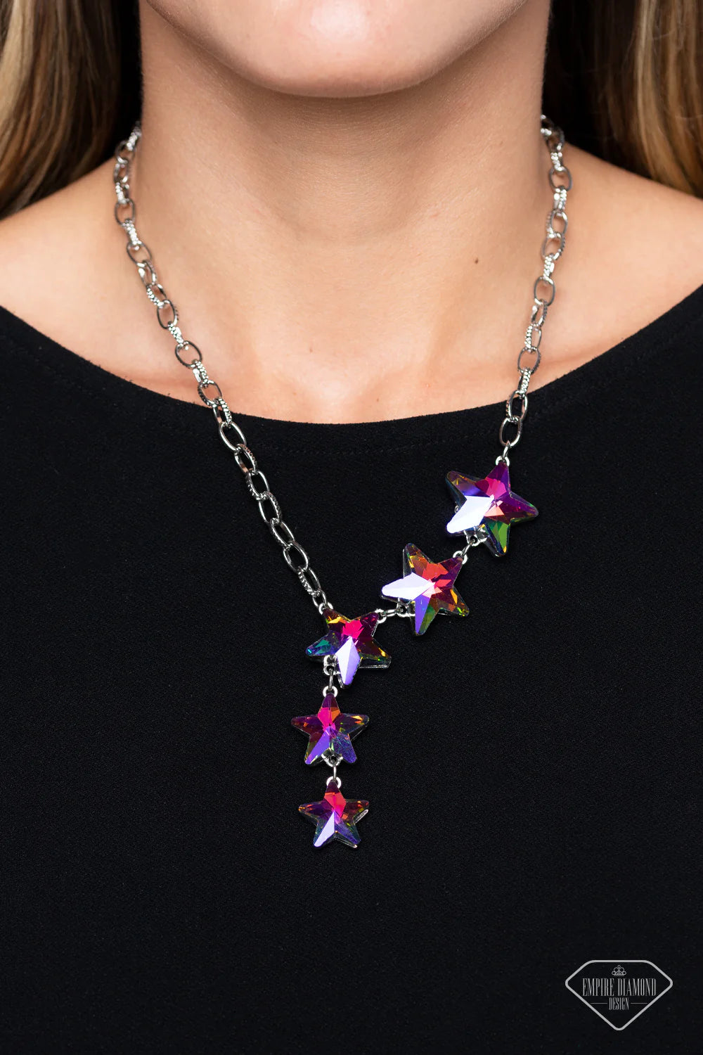 Paparazzi Accessories Star-Crossed Sparkle - Multi Textured silver hoops link together for a radiant finish across the neckline. Featuring a stellar UV shimmer, a collection of gem stars decrease in size as they cascade down the neckline in a diagonal pat