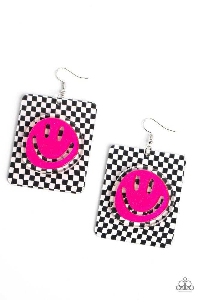 Paparazzi Accessories Cheeky Checkerboard - Pink Set against a trendy, checkerboard backdrop, an oversized, sparkly, Beetroot Purple smiley face stands out for a cheerfully captivating statement piece near the ear. Earring attaches to a standard fishhook