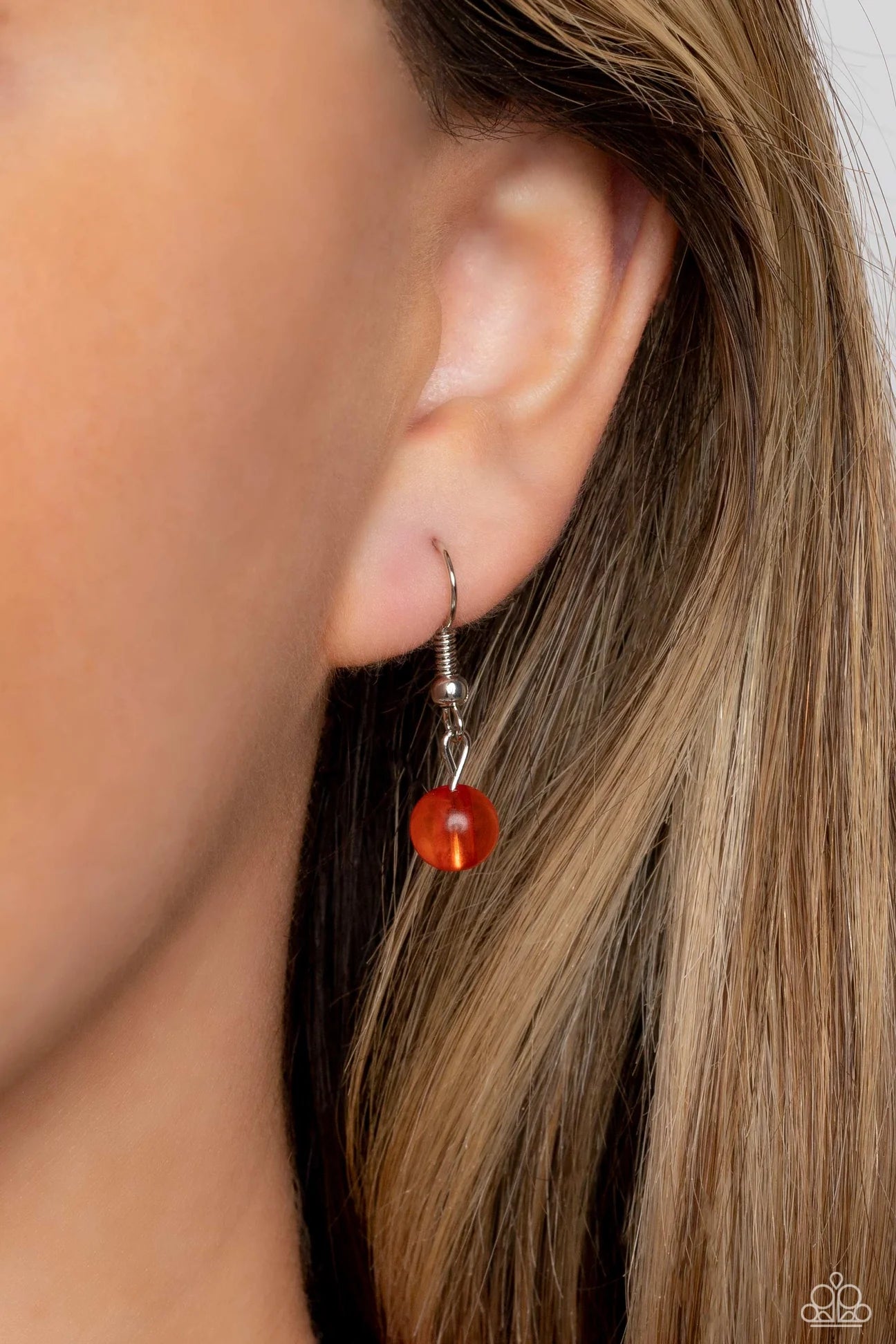 Paparazzi Accessories Warped Whimsicality - Orange An earthy collection of dotted silver beads, rounded milky orange beads, studded silver rings, orange-spotted ceramic-like beads and textured silver beads are threaded along an invisible wire below the co