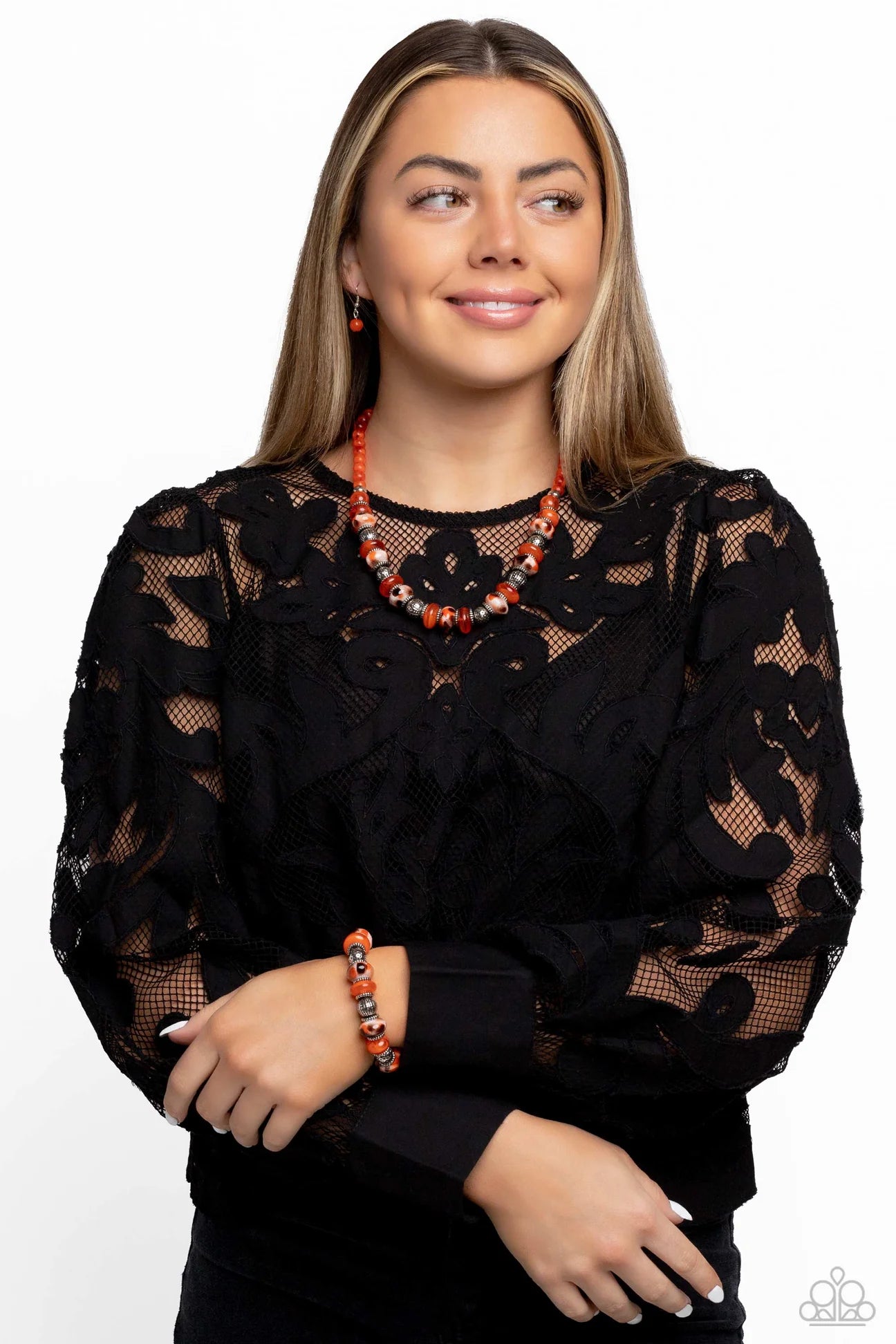 Paparazzi Accessories Warped Whimsicality - Orange An earthy collection of dotted silver beads, rounded milky orange beads, studded silver rings, orange-spotted ceramic-like beads and textured silver beads are threaded along an invisible wire below the co