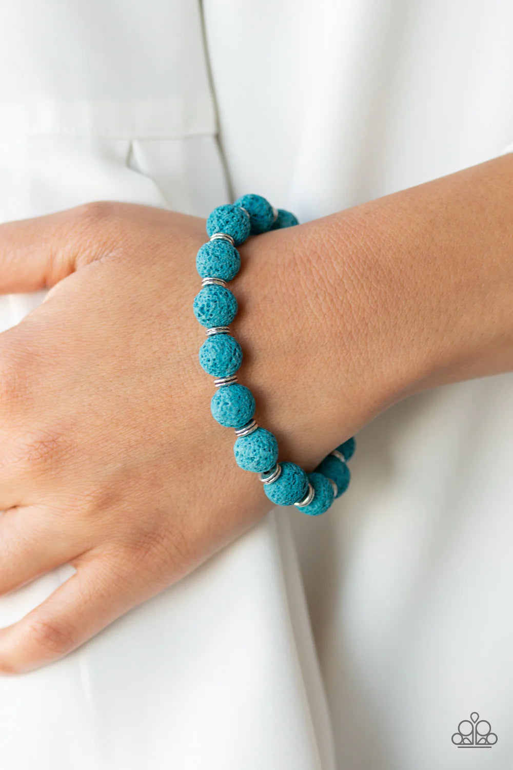 Paparazzi Accessories Luck - Blue A collection of dainty silver rings and earthy blue lava rock beads are threaded along a stretchy band around the wrist in a seasonal style. Sold as one individual bracelet. Jewelry