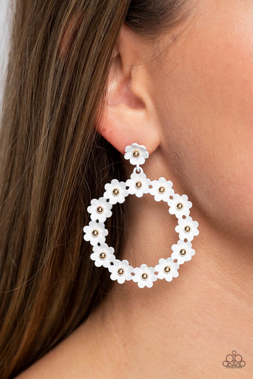 Paparazzi Accessories Daisy Meadows - White Hanging from a solitaire white daisy, a dainty collection of white daisies bloom into a free-spirited wreath below the ear. Gold studs gleam from the centers of the tactile flowers, adding an industrial sheen to