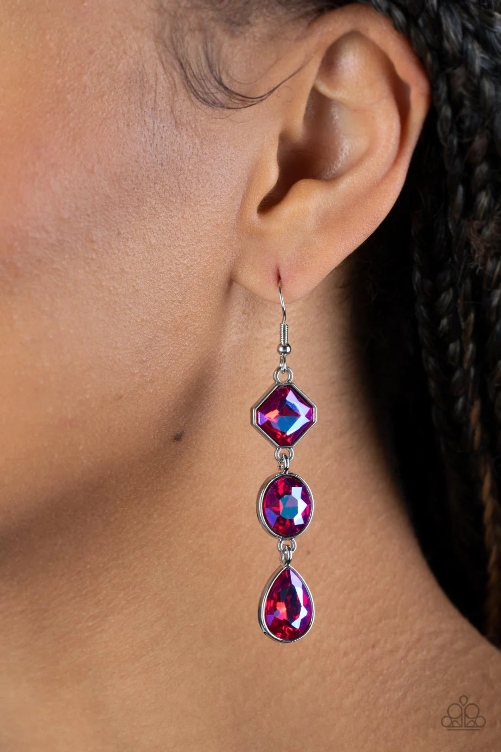 Paparazzi Accessories Reflective Rhinestone - Pink Featuring a stellar UV finish, three iridescent pink rhinestones delicately link into a refined lure. Featuring teardrop, round, and emerald style cuts, the sparkly rhinestones are delicately encased in s