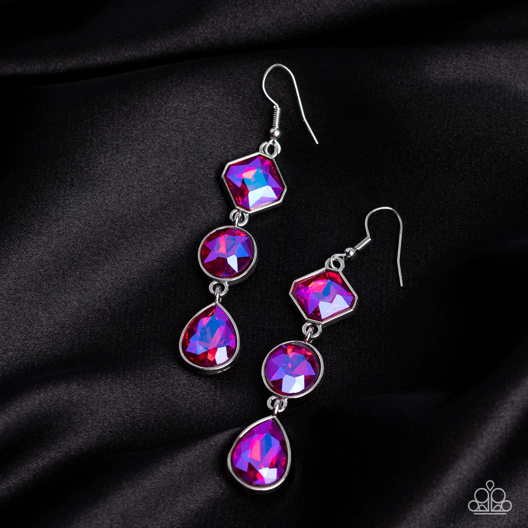 Paparazzi Accessories Reflective Rhinestone - Pink Featuring a stellar UV finish, three iridescent pink rhinestones delicately link into a refined lure. Featuring teardrop, round, and emerald style cuts, the sparkly rhinestones are delicately encased in s