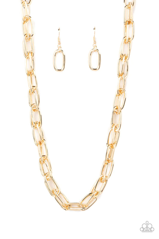 Paparazzi Accessories Tough Call - Gold A gritty collection of oversized oval gold links boldly interlocks below the collar, resulting in an intense industrial look. Features an adjustable clasp closure. Sold as one individual necklace. Includes one pair