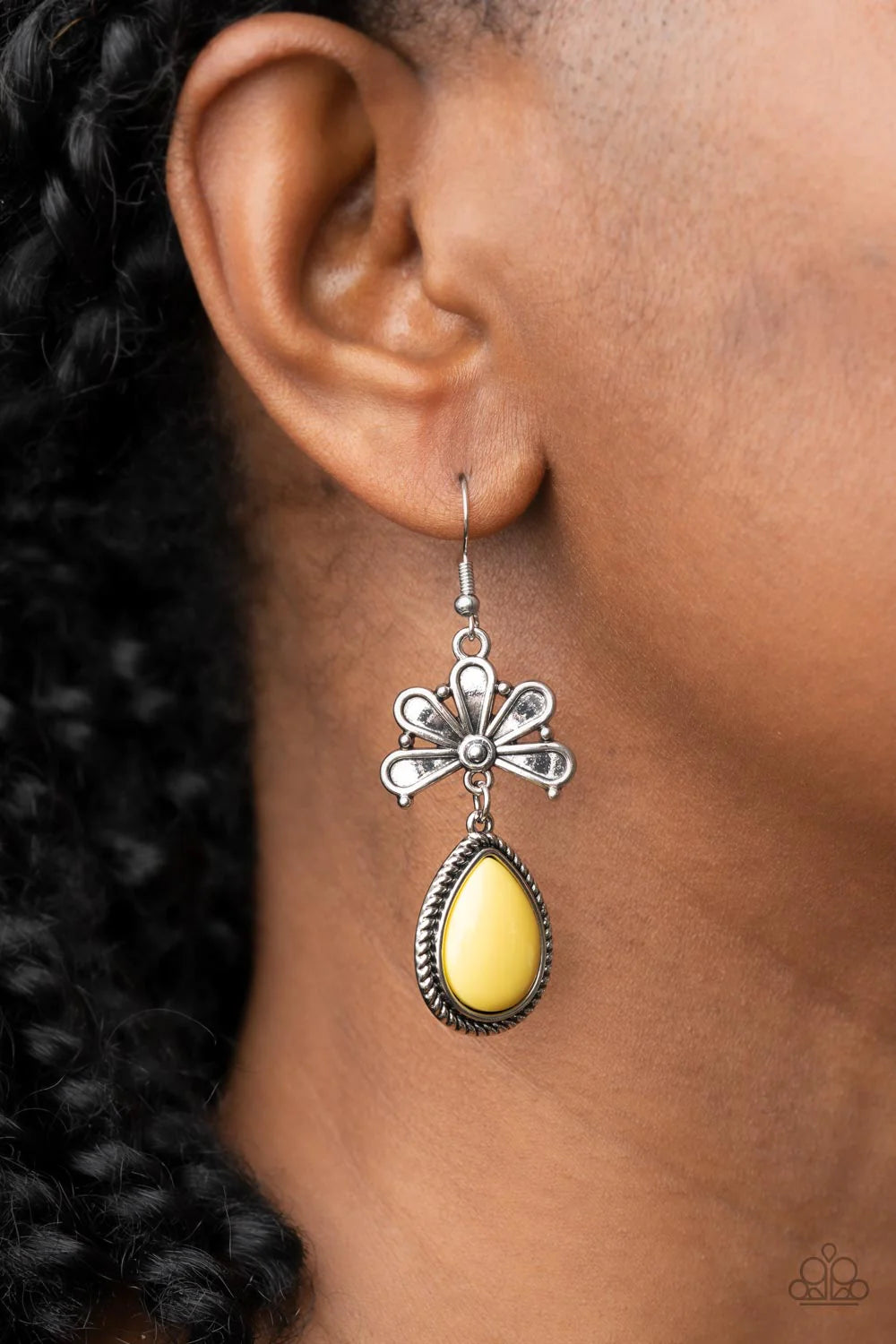 Paparazzi Accessories Brightly Blooming - Yellow Bordered in a silver ropelike frame, a shiny yellow teardrop bead swings from the bottom of an antiqued floral frame for a whimsical fashion. Earring attaches to a standard fishhook fitting. Sold as one pai