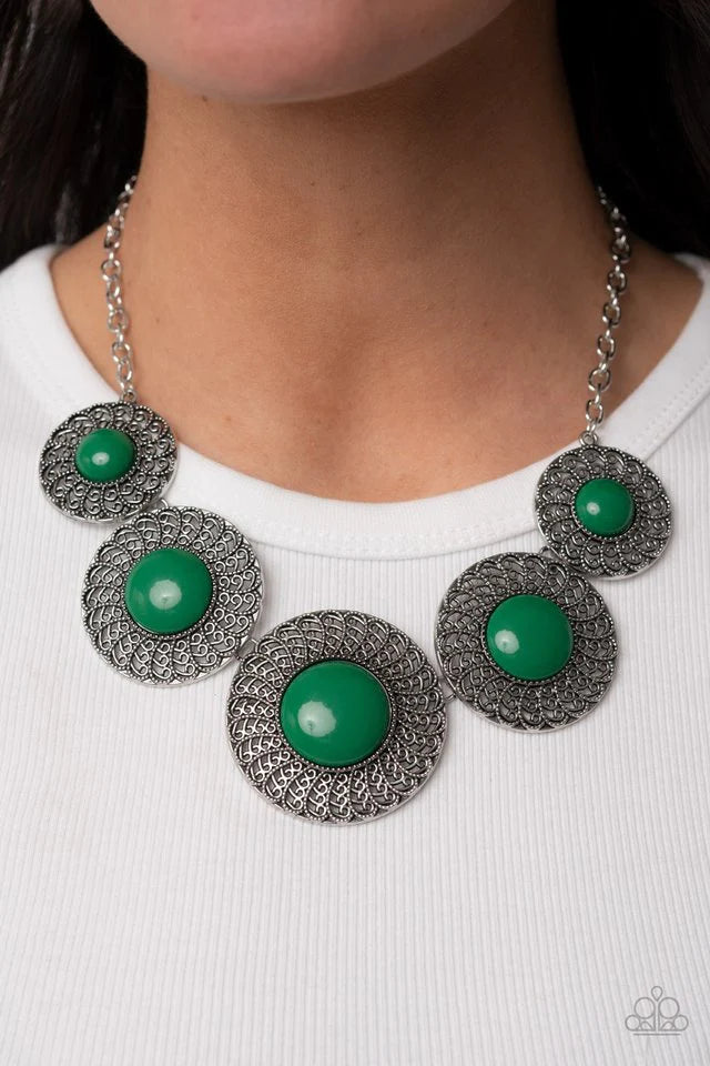 Paparazzi Accessories Detail Orientated - Green Dotted with bubbly Leprechaun beads, silver discs spinning with swirly petal motifs gradually increase in size as they link below the collar for a statement-making floral fashion. Features an adjustable clas