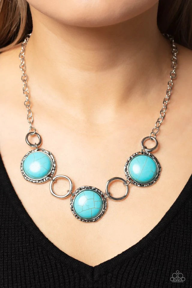 Paparazzi Accessories Saharan Scope - Blue Warped silver hoops in varying sizes alternate along hammered silver frames. Pressed into the hammered frames, oversized turquoise stones add a vibrant, earthy flair to the summery palette. Features an adjustable