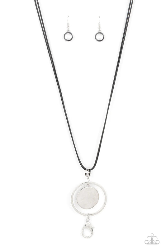 Paparazzi Accessories Rural Reflection - Black A silver disc swings from the top of an airy silver hoop, creating a shimmery pendant at the bottom of lengthened black cords for a colorful fashion. A lobster clasp hangs from the bottom of the design to all