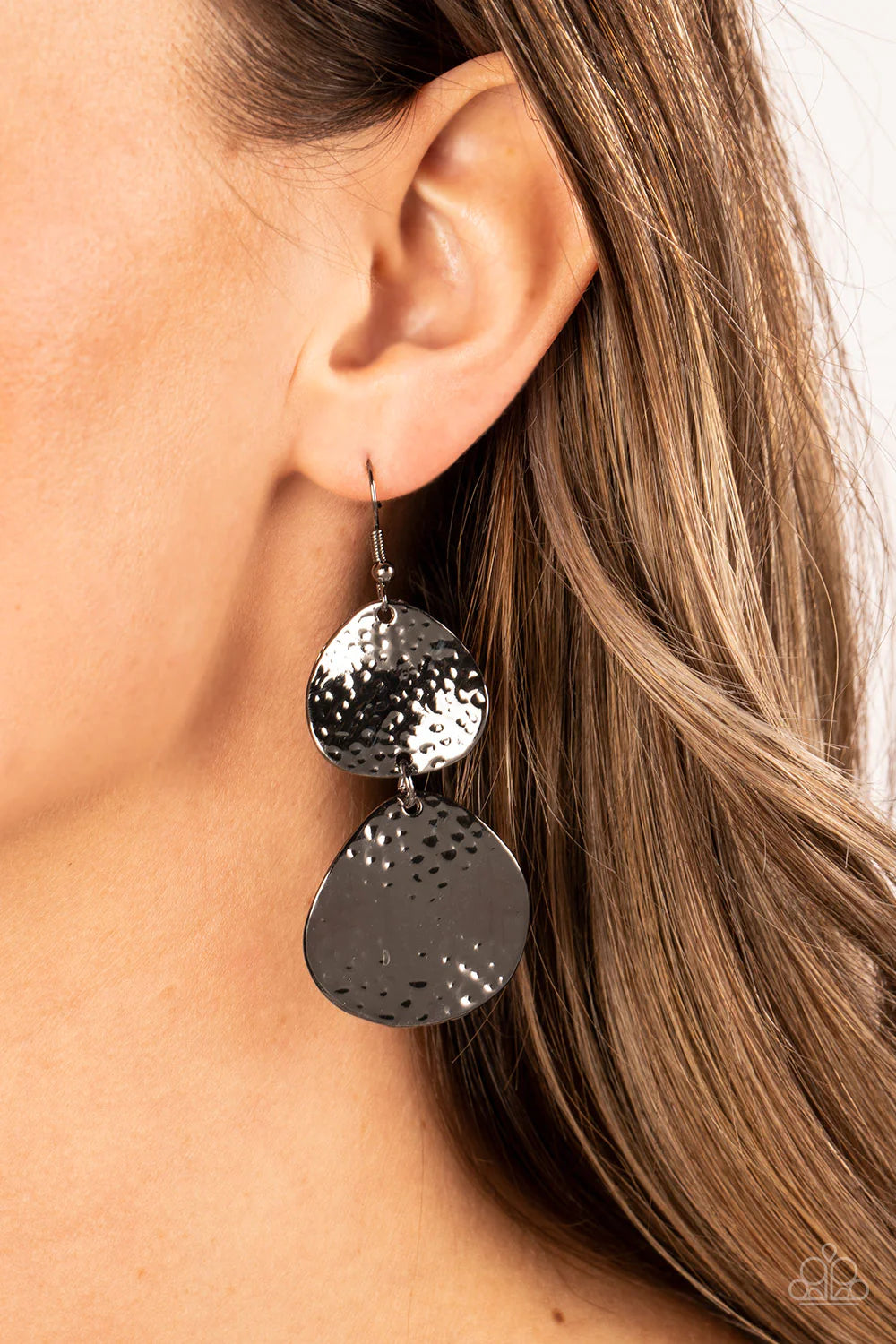 Paparazzi Accessories Bait and Switch - Black Featuring hammered and beveled finishes, a gunmetal teardrop delicately links with an asymmetrical gunmetal disc, resulting in a stunning lure. Earring attaches to a standard fishhook fitting. Sold as one pair