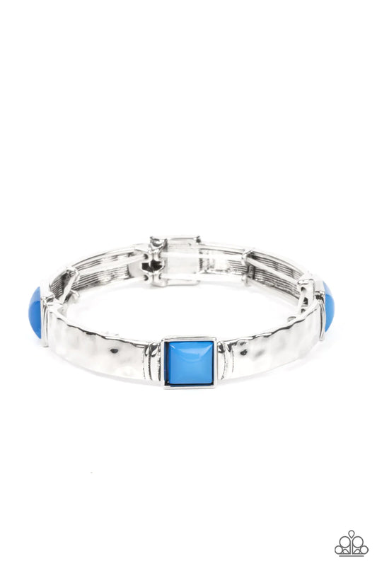 Paparazzi Accessories Totally Terraform - Blue Dotted with a square blue beaded accent, a shimmery series of hammered silver frames are delicately threaded along stretchy bands around the wrist for an adventurous pop of color. Sold as one individual brace