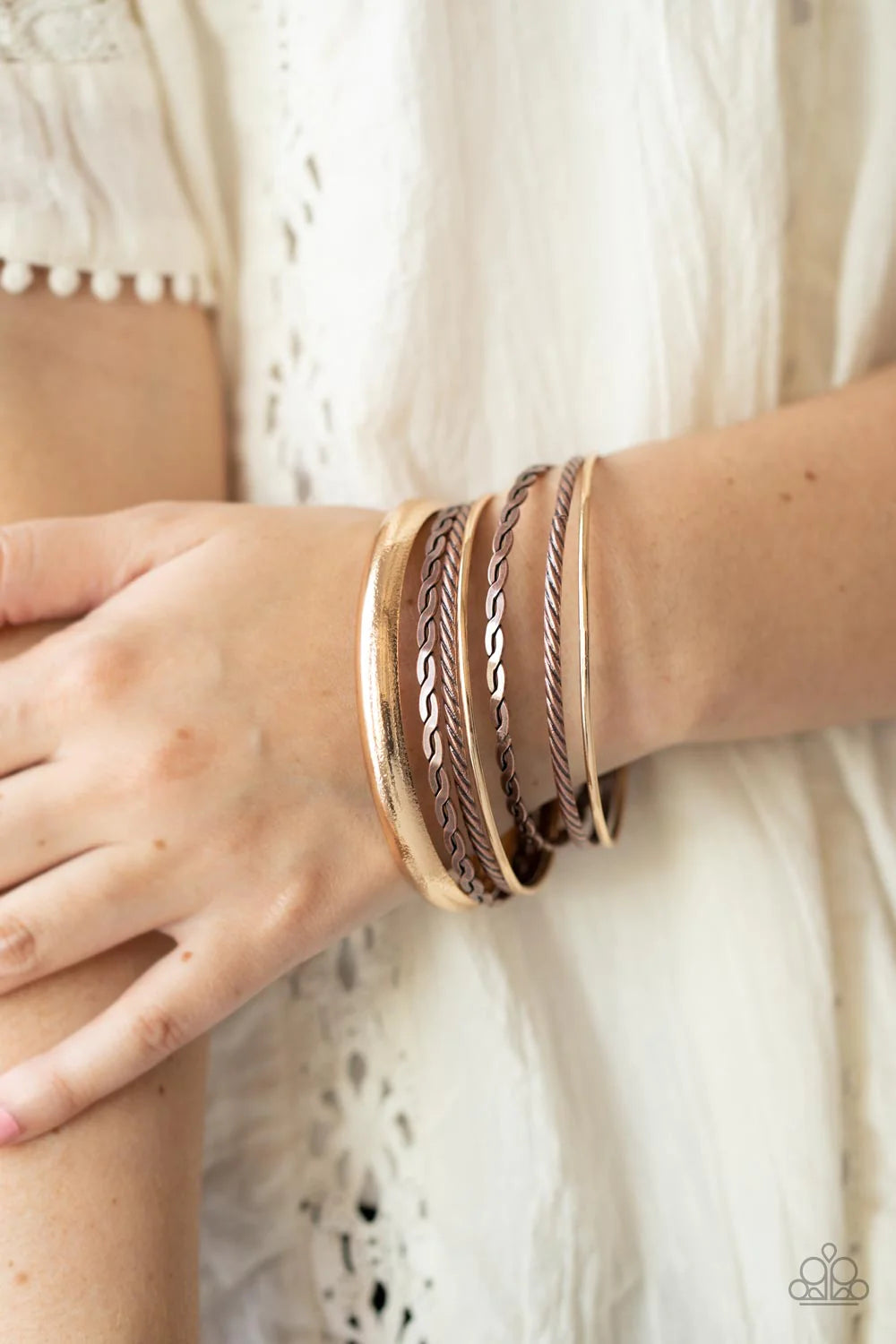 Paparazzi Accessories Trophy Texture - Multi Brushed in an antiqued finish, a mismatched collection of braided and hammered copper bangles join with shiny and textured gold bangles as they stack across the wrist for a classic mixed metallic look. Sold as
