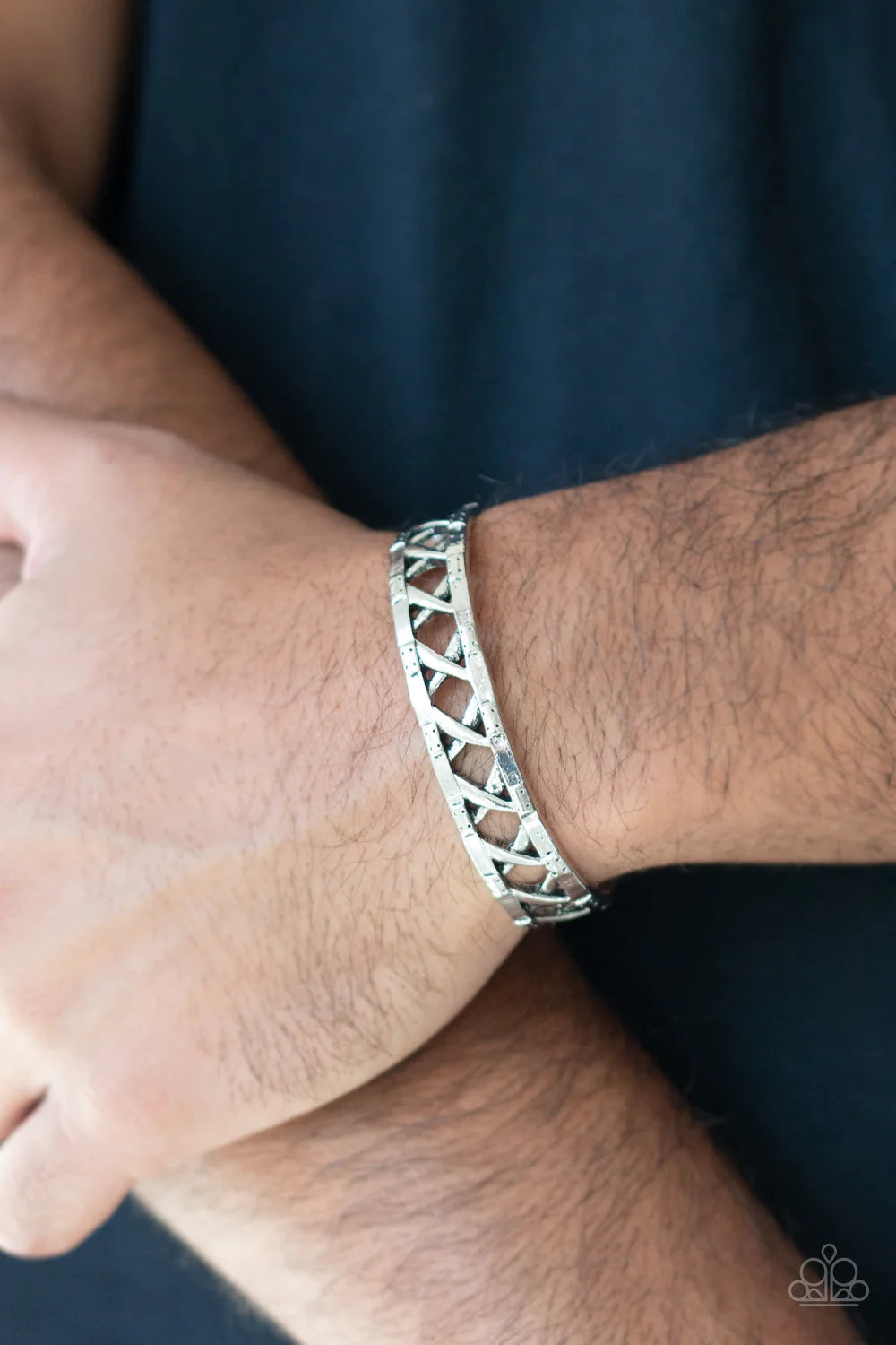 Paparazzi Accessories In Over Your METALHEAD - Silver Asymmetrical bars crisscross inside the airy center of a rustic silver cuff, creating an edgy display around the wrist. Sold as one individual bracelet. Jewelry