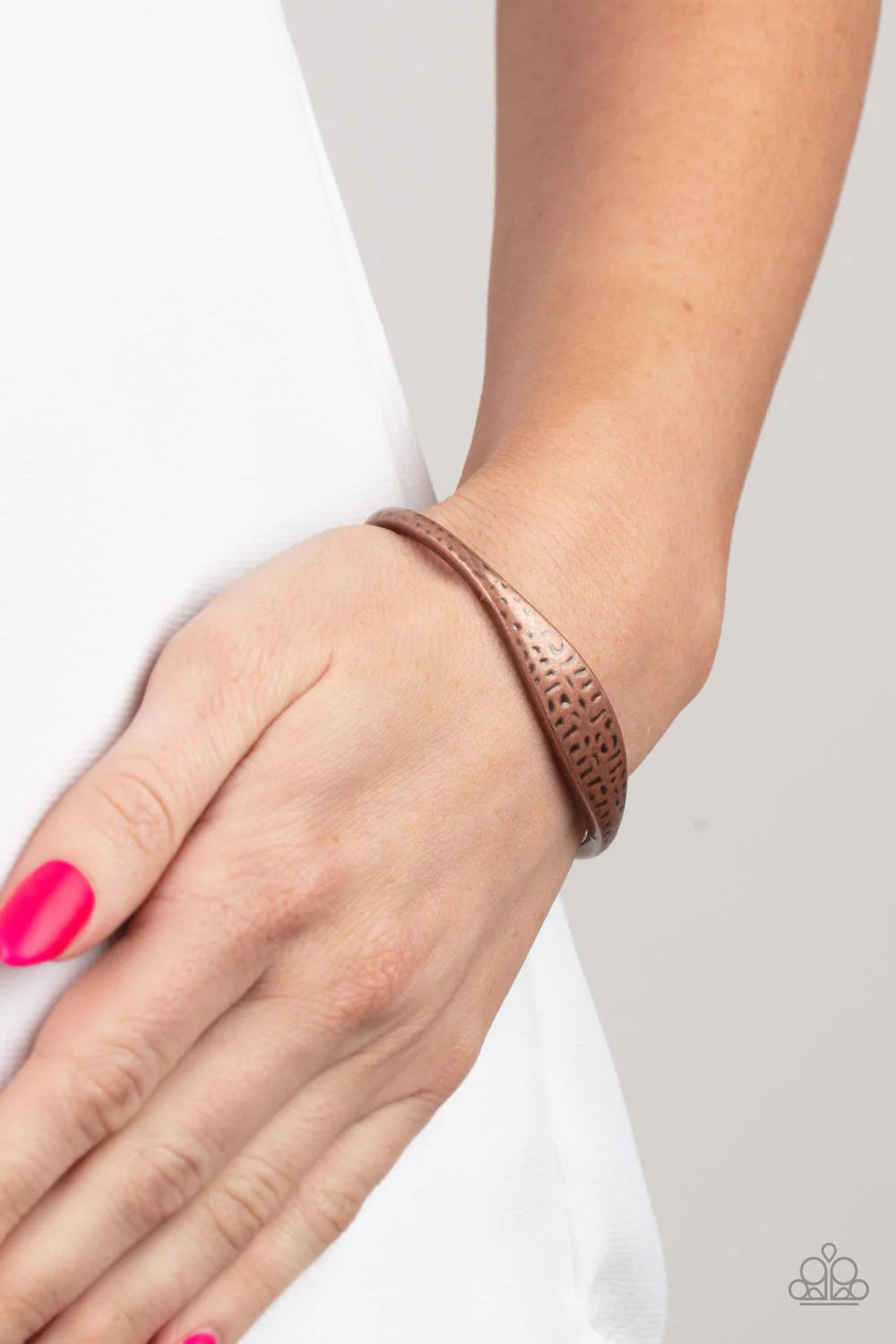 Paparazzi Accessories Ancient Accolade - Copper The center of a dainty copper cuff is flattened and hammered in antiqued details, creating a chic rustic centerpiece around the wrist. Sold as one individual bracelet. Jewelry